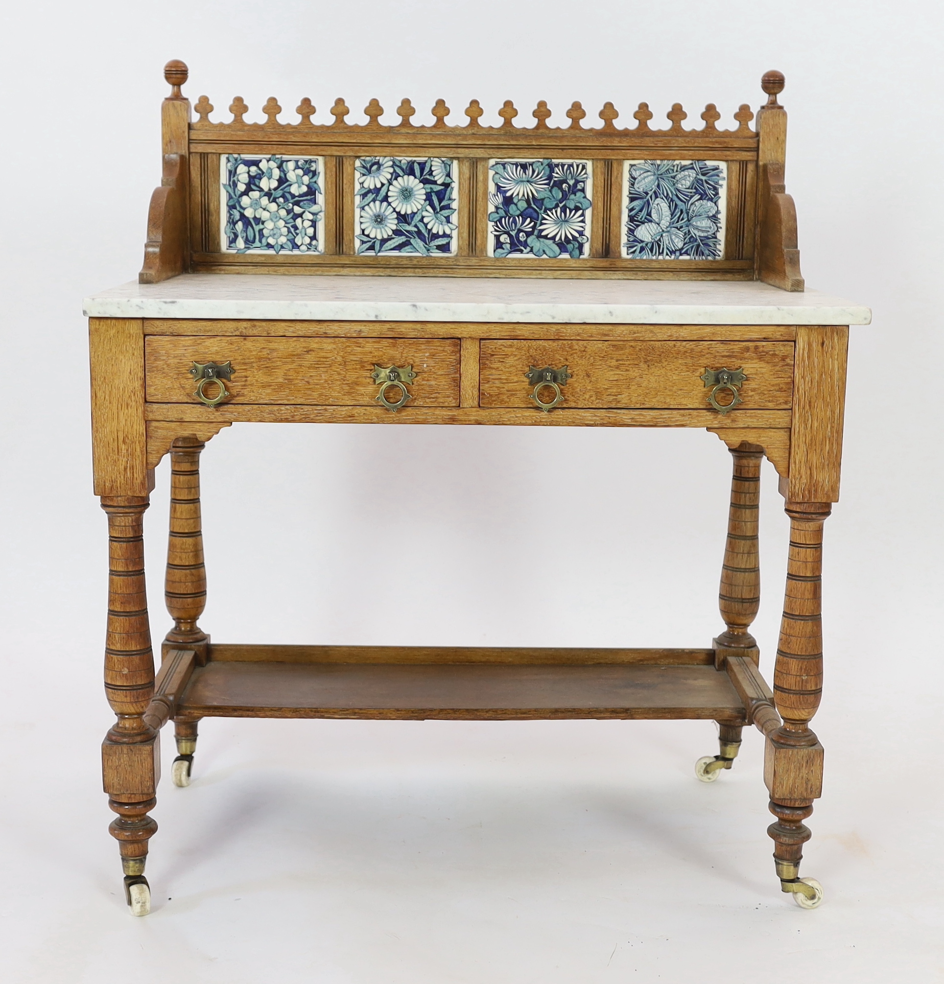 Lewis Foreman Day (1845-1910). A Victorian Aesthetic movement golden oak and marble washstand, width 90cm, depth 51.5cm, height 104cm
